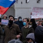 a group of people holding signs